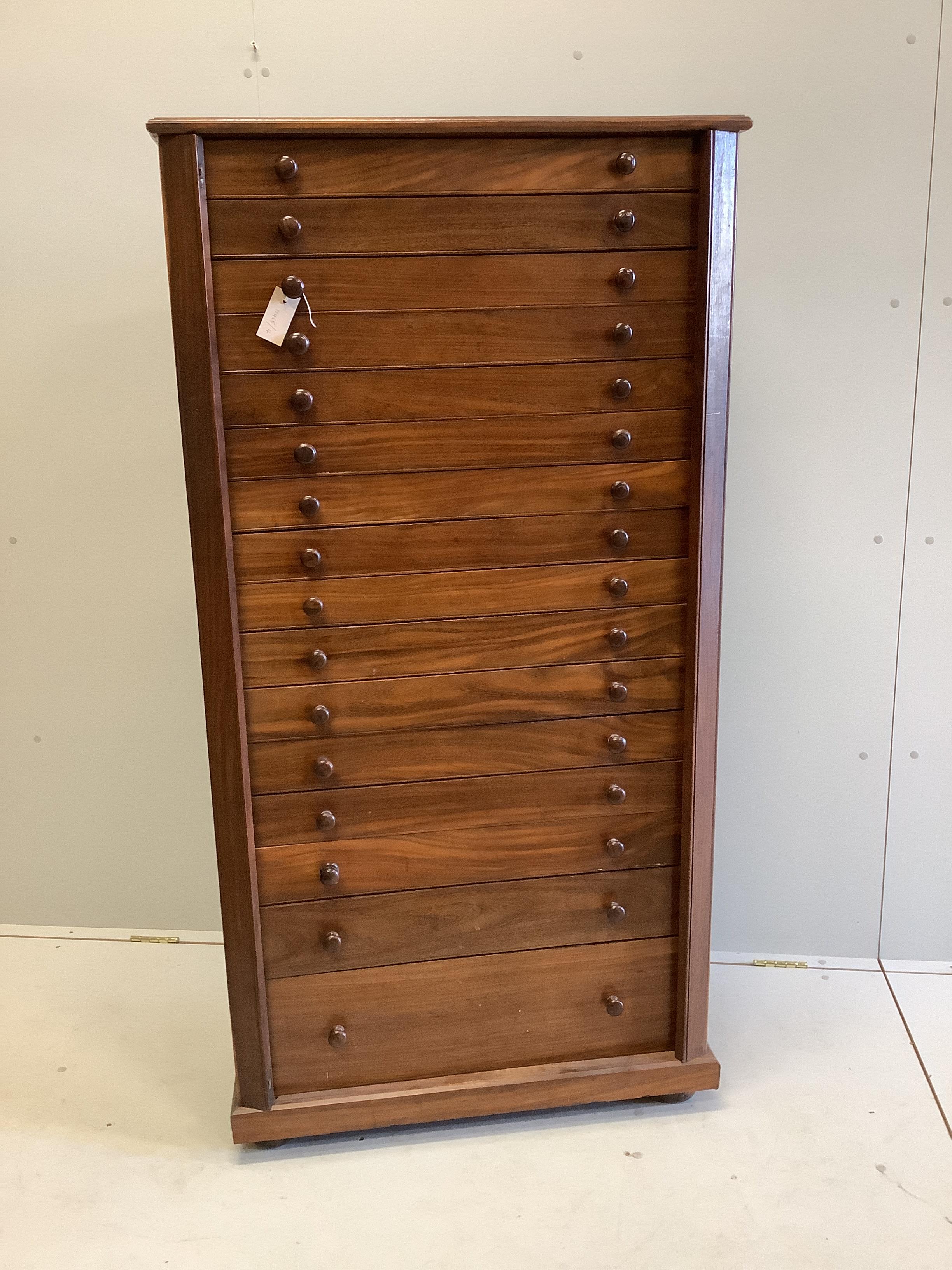 A mid century Sri Lankan mahogany collector's cabinet fitted sixteen graduated drawers, back panel stamped Don Andris, Cabinet Makers, Colombo, width 80cm, depth 44cm, height 156cm